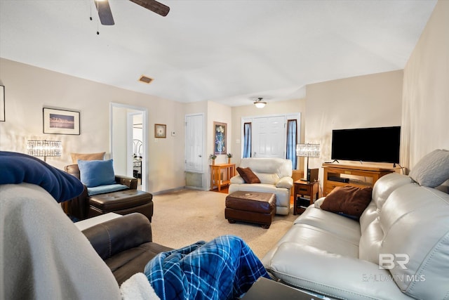 living room with ceiling fan and light carpet