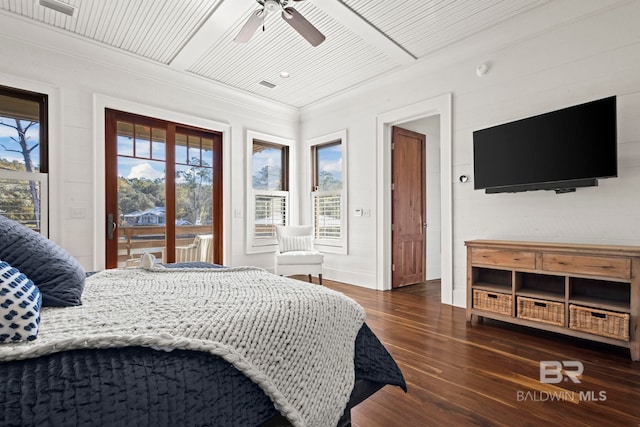 bedroom featuring ceiling fan, access to exterior, multiple windows, and dark hardwood / wood-style flooring