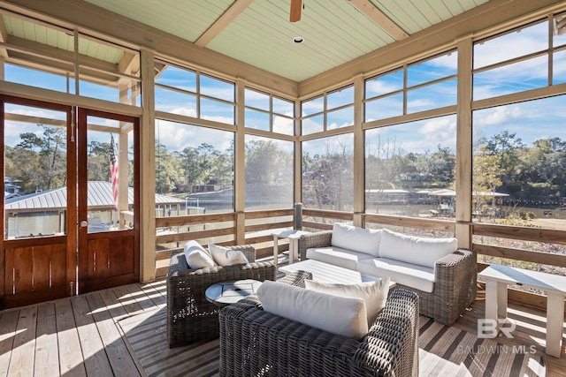 sunroom featuring ceiling fan