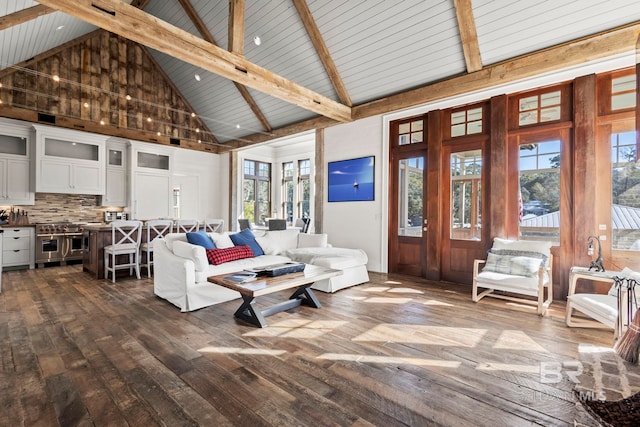 living room with dark wood-type flooring, beamed ceiling, and high vaulted ceiling