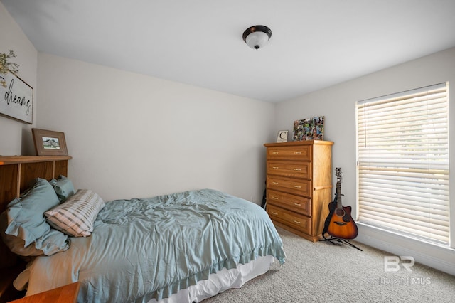 bedroom featuring light colored carpet