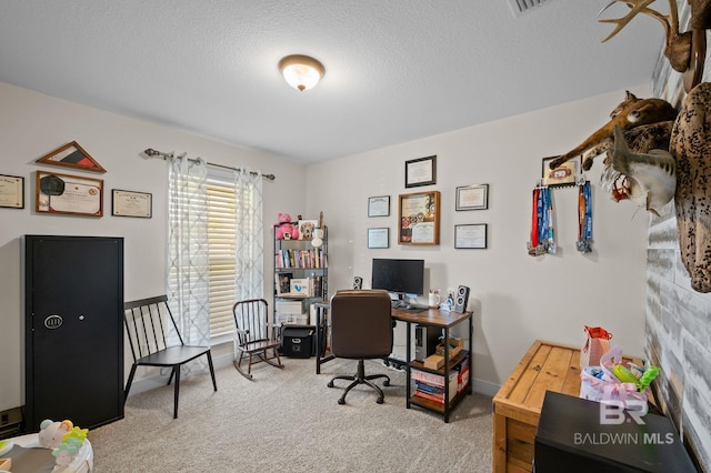 office space featuring carpet floors and a textured ceiling