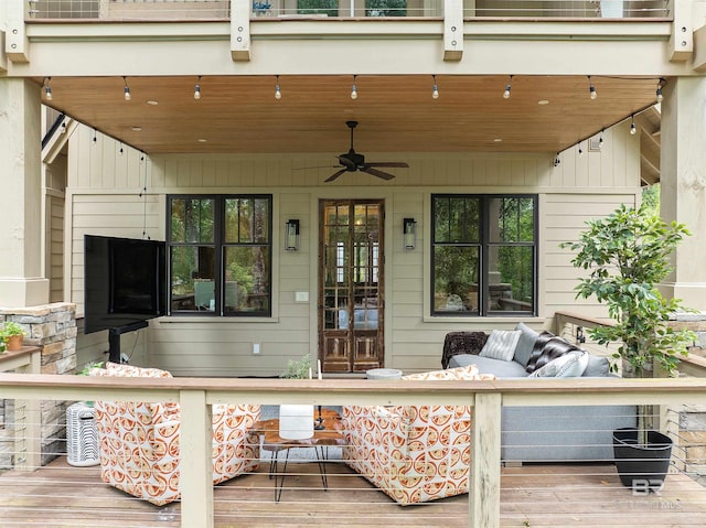 view of patio featuring french doors, ceiling fan, a deck, and outdoor lounge area