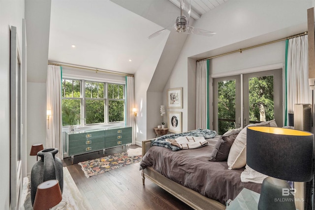 bedroom featuring hardwood / wood-style flooring, lofted ceiling with beams, ceiling fan, and french doors