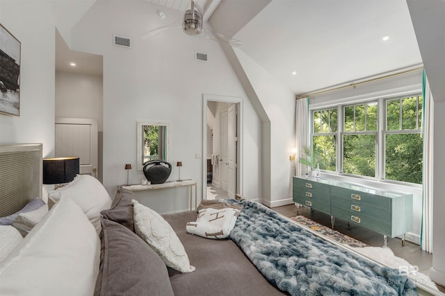 bedroom featuring ceiling fan, high vaulted ceiling, and multiple windows