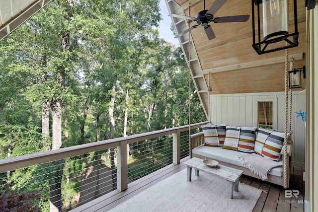 wooden terrace featuring ceiling fan