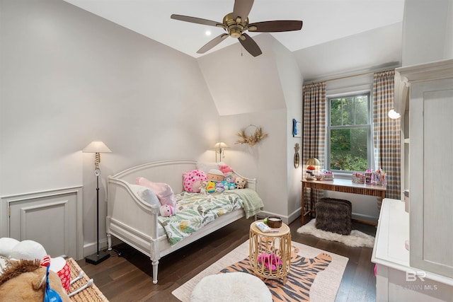 bedroom with ceiling fan, dark wood-type flooring, and vaulted ceiling