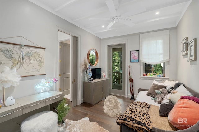 living room featuring wood-type flooring, beam ceiling, and ceiling fan