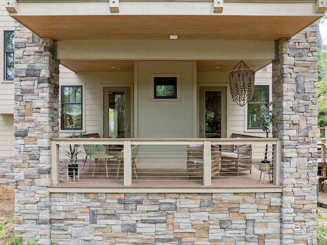 entrance to property featuring covered porch