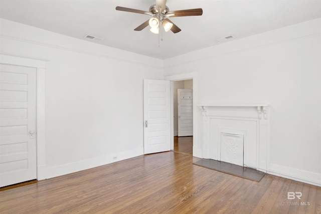 spare room featuring ceiling fan and dark hardwood / wood-style flooring