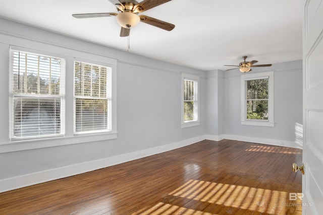 unfurnished room with hardwood / wood-style flooring and ceiling fan