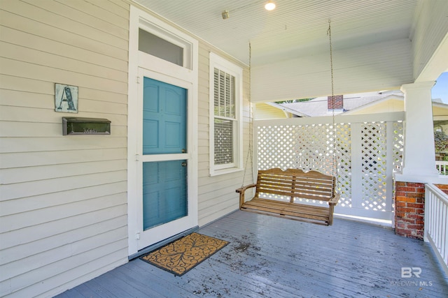 entrance to property featuring covered porch