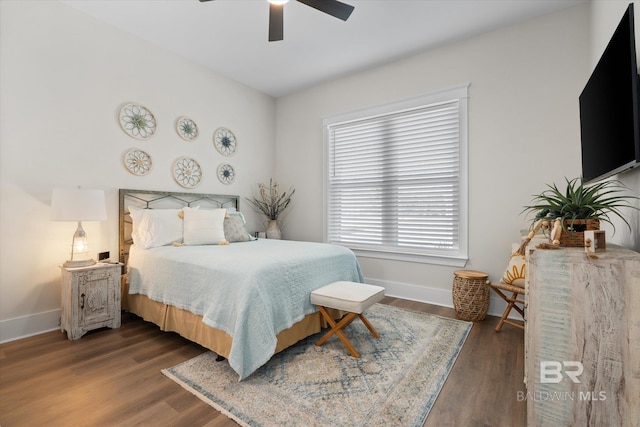 bedroom featuring ceiling fan and dark hardwood / wood-style floors