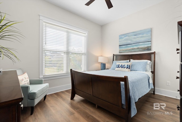 bedroom featuring dark wood-type flooring and ceiling fan