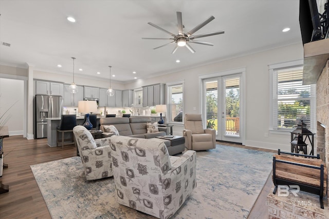 living room featuring ornamental molding, dark hardwood / wood-style floors, and ceiling fan