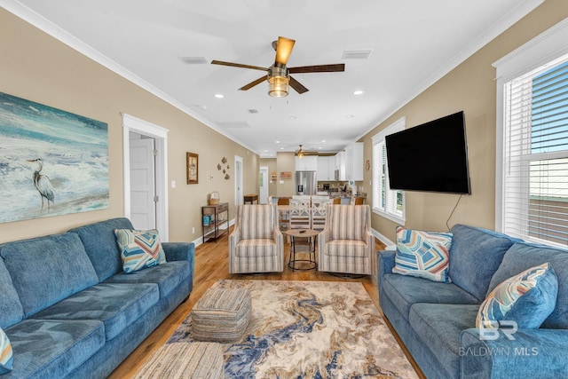 566 Boykin Ct N, Gulf Shores, AL 36542 - living room featuring ceiling fan, light wood-style floors, baseboards, ornamental molding, and recessed lighting