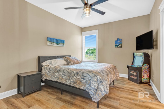 566 Boykin Ct N, Gulf Shores, AL 36542 - bedroom featuring wood finished floors, baseboards, and ceiling fan