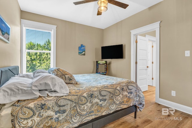 566 Boykin Ct N, Gulf Shores, AL 36542 - bedroom featuring wood finished floors, baseboards, and ceiling fan
