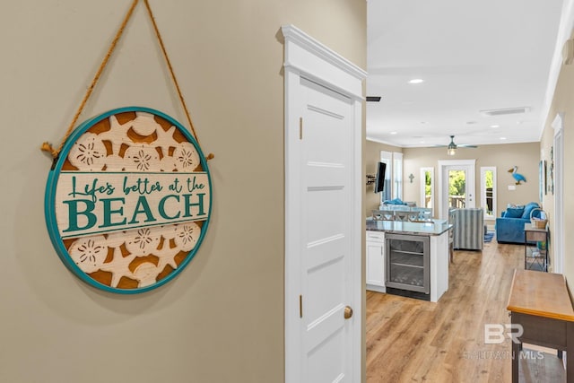 566 Boykin Ct N, Gulf Shores, AL 36542 - corridor featuring beverage cooler, light wood-type flooring, and recessed lighting