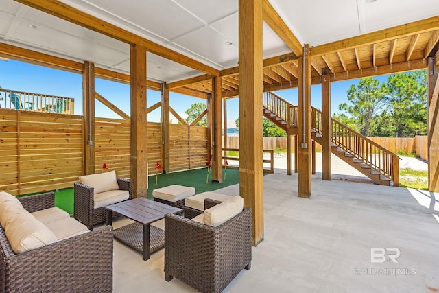 566 Boykin Ct N, Gulf Shores, AL 36542 - view of patio with stairs, a fenced backyard, and outdoor lounge area