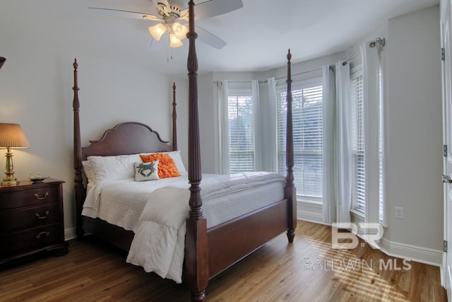 bedroom featuring hardwood / wood-style floors and ceiling fan