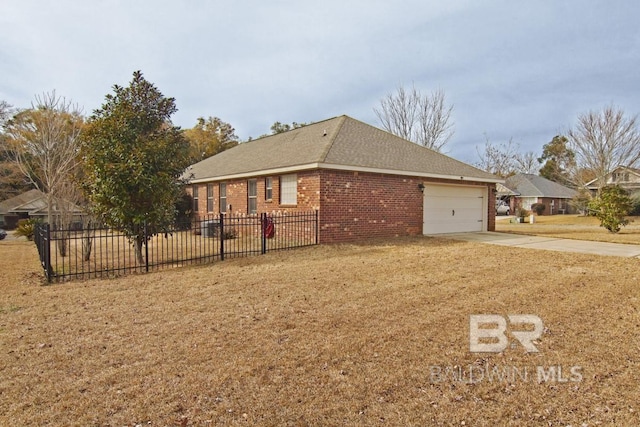 view of side of home with a garage and a lawn