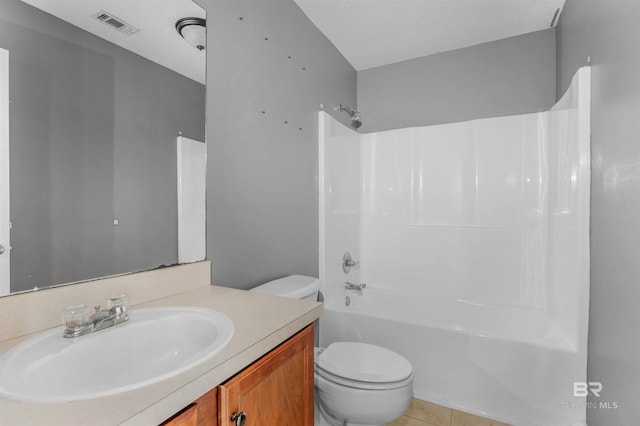 full bath with vanity, visible vents,  shower combination, a textured ceiling, and toilet