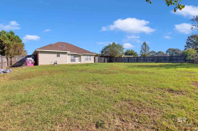 view of yard with a fenced backyard