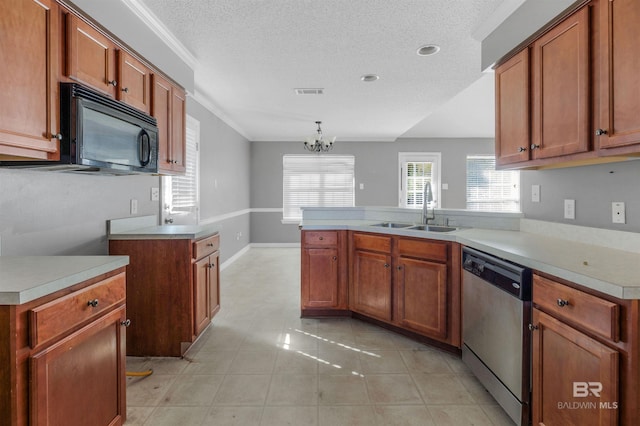 kitchen with visible vents, black microwave, a peninsula, stainless steel dishwasher, and a sink