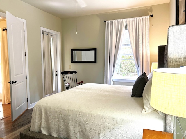 bedroom featuring dark wood-style flooring