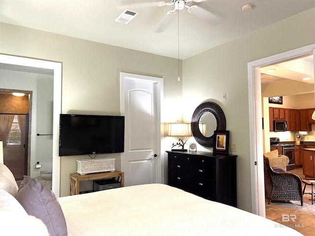 bedroom with visible vents and connected bathroom