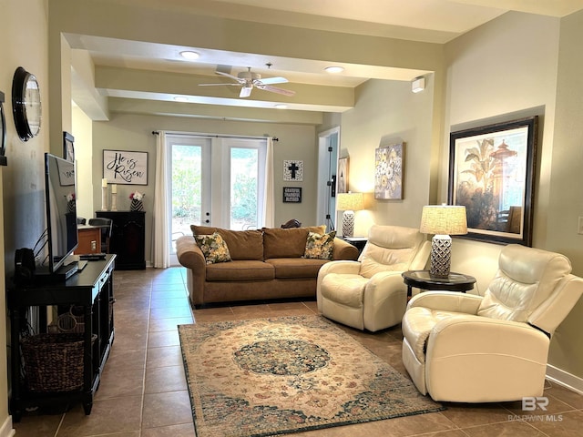 living room with tile patterned floors, ceiling fan, beamed ceiling, and french doors