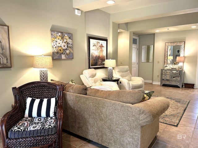 living area with tile patterned flooring, baseboards, and recessed lighting