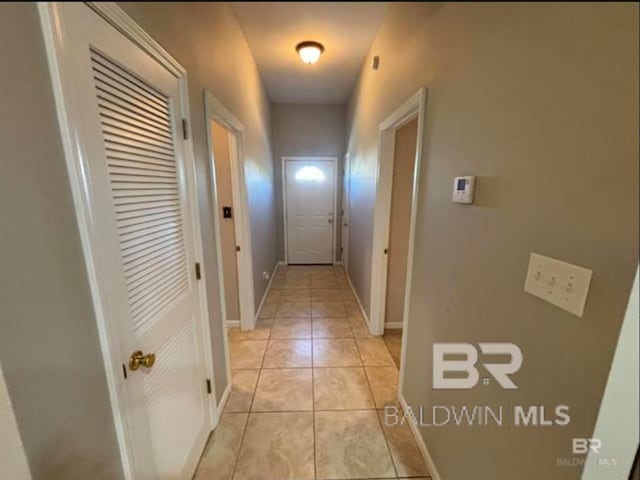 hallway featuring light tile patterned floors