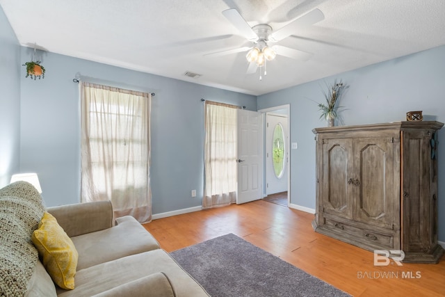 103 Hickory Ct, Daphne, AL 36526 - living area featuring light wood-style flooring, ceiling fan, and baseboards