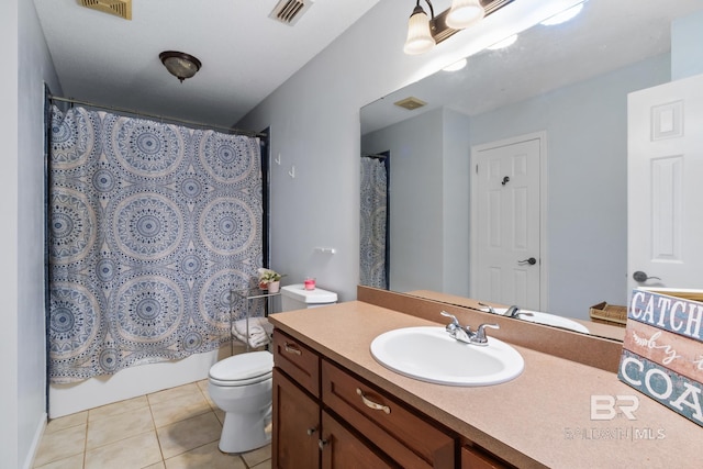 103 Hickory Ct, Daphne, AL 36526 - full bath featuring vanity, toilet, tile patterned flooring, and shower / bath combo with shower curtain