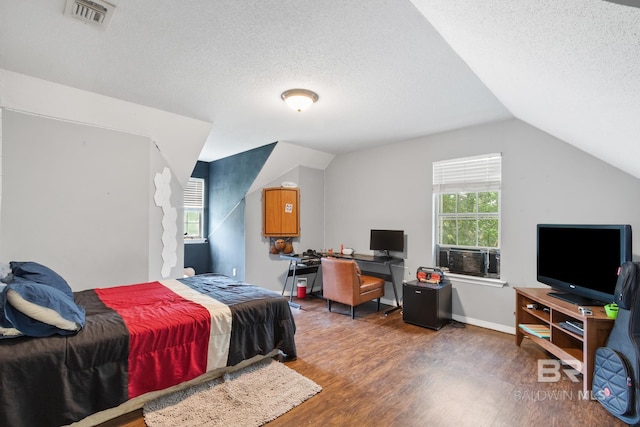103 Hickory Ct, Daphne, AL 36526 - bedroom with wood finished floors, a textured ceiling, cooling unit, and lofted ceiling
