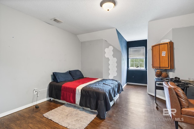 103 Hickory Ct, Daphne, AL 36526 - bedroom with wood finished floors, baseboards, and a textured ceiling