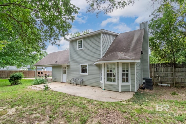 103 Hickory Ct, Daphne, AL 36526 - rear view of property with a chimney, a patio, central air condition unit, and roof with shingles