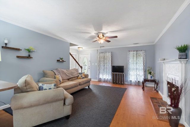 103 Hickory Ct, Daphne, AL 36526 - living area featuring ceiling fan, ornamental molding, wood finished floors, baseboards, and stairs