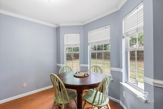 103 Hickory Ct, Daphne, AL 36526 - dining space with plenty of natural light, ornamental molding, wood finished floors, and baseboards