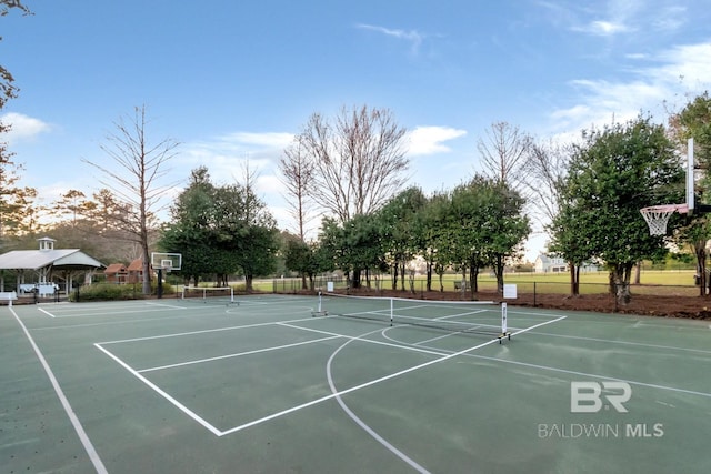 view of basketball court featuring community basketball court and fence