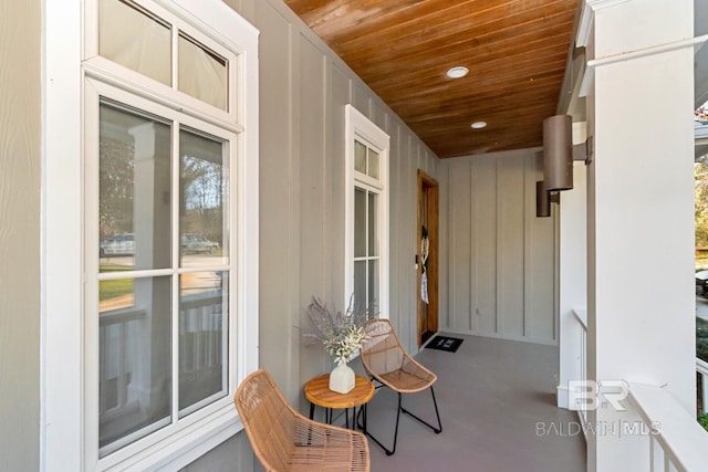 property entrance featuring board and batten siding
