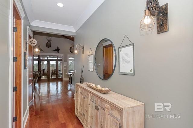 hallway featuring french doors, baseboards, and wood finished floors