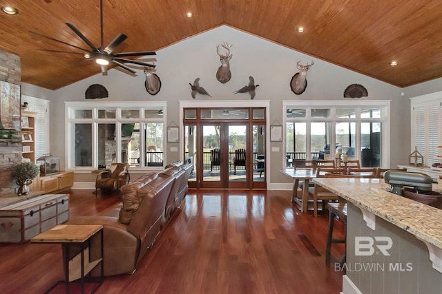 living area with ceiling fan, wood ceiling, french doors, dark wood-style floors, and high vaulted ceiling