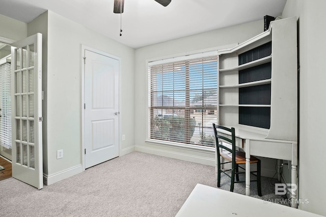 carpeted home office with ceiling fan