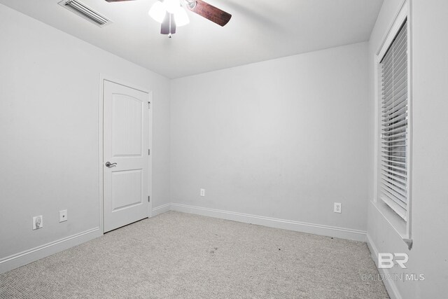 unfurnished bedroom with ceiling fan and light carpet