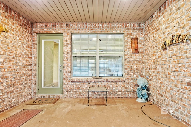 entrance to property featuring a patio