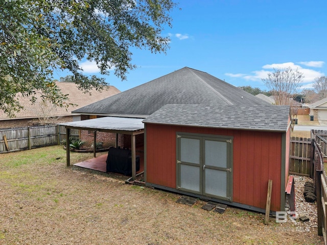 view of outbuilding featuring a lawn