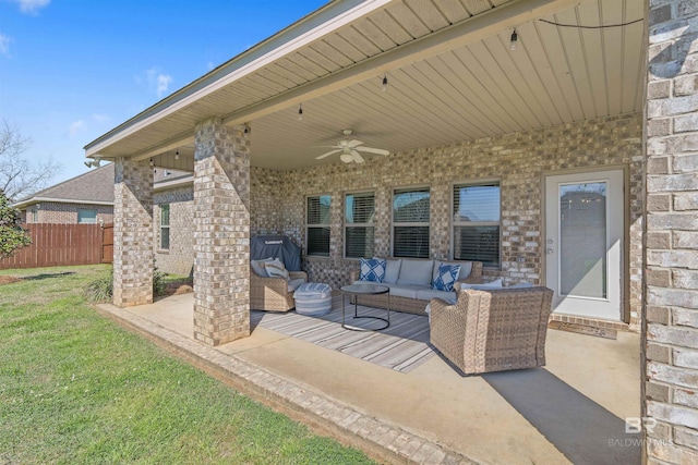 view of patio featuring an outdoor living space, fence, and ceiling fan